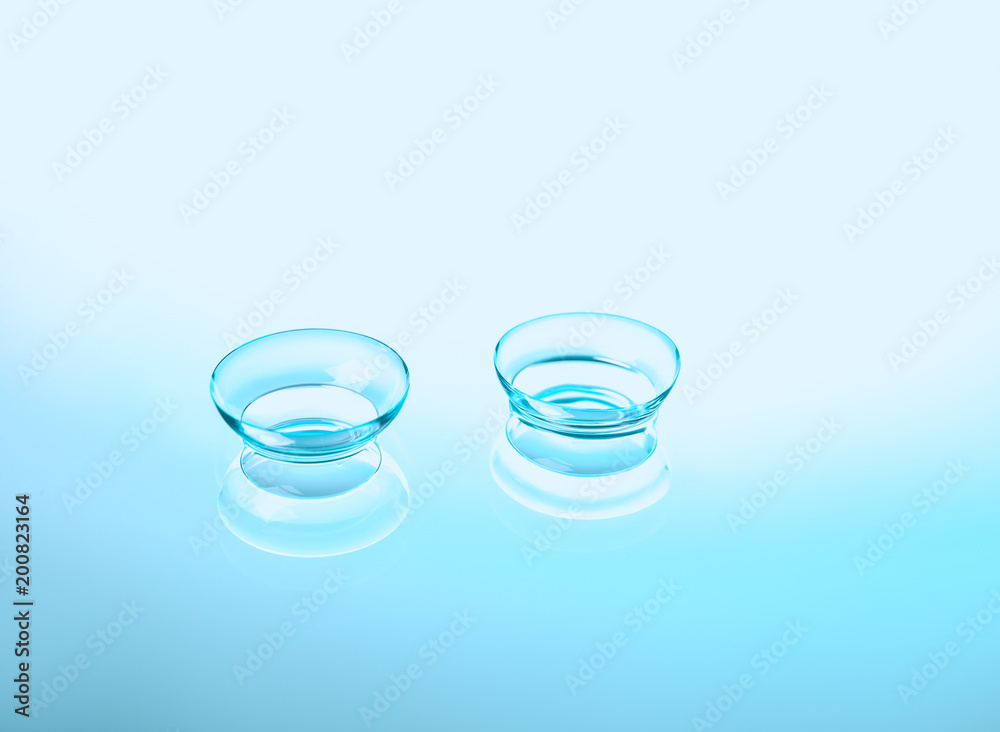 Contact lenses on color background Contact lenses on color background