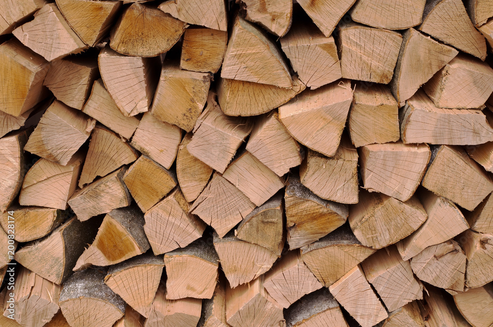 Cut and stacked hard woods of different shapes and sizes Cut and stacked hard woods of different shapes and sizes