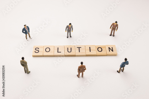 businessman figures meeting on solution word