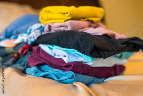 stack of women's shirts and sweaters 