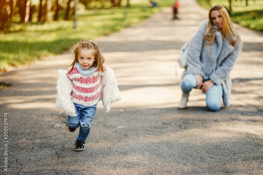 Fototapeta premium young mother with toddler