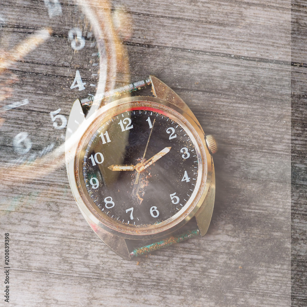 old wrist watch on a wooden background