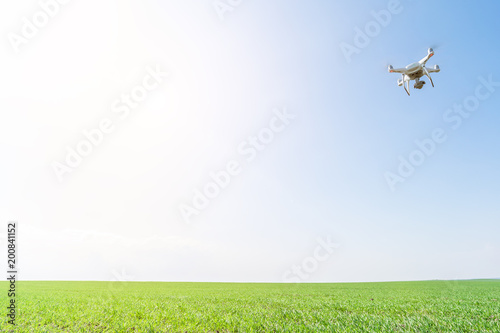 drone quad copter on green corn field