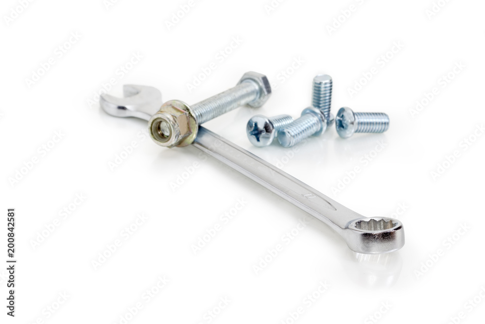Combination wrench among of bolts, screws, nuts at selective focus Combination wrench among of bolts, screws, nuts at selective focus