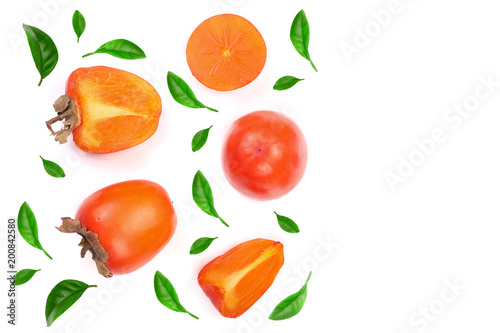 Fototapeta Naklejka Na Ścianę i Meble -  persimmon decorated with leaves isolated on white background with copy space for your text. Top view. Flat lay pattern