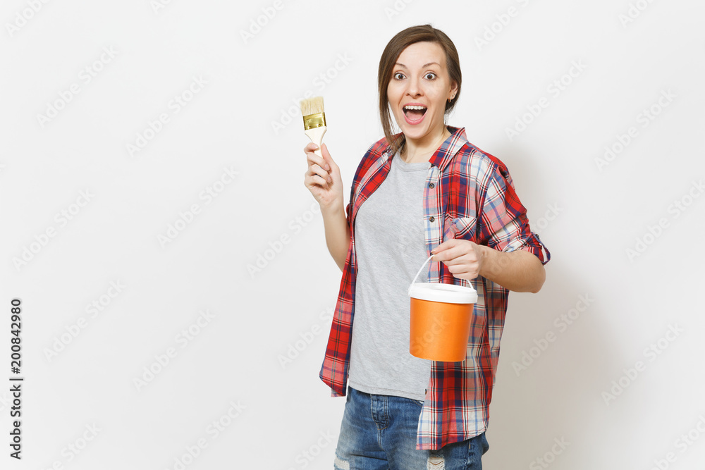 Young fun overjoyed beautiful woman in casual clothes holding paint bucket, paint brush isolated on white background. Instruments, accessories, tools for renovation apartment room. Repair home concept Young fun overjoyed beautiful woman in casual clothes holding paint bucket, paint brush isolated on white background. Instruments, accessories, tools for renovation apartment room. Repair home concept