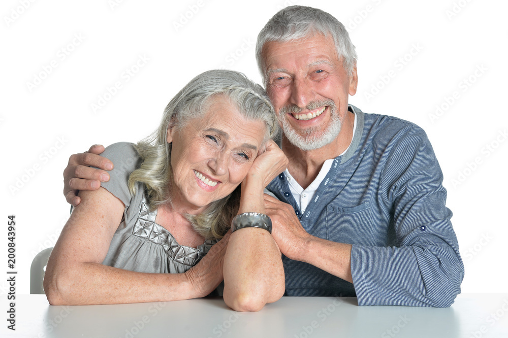Portrait of happy couple sitting at table Portrait of happy couple sitting at table