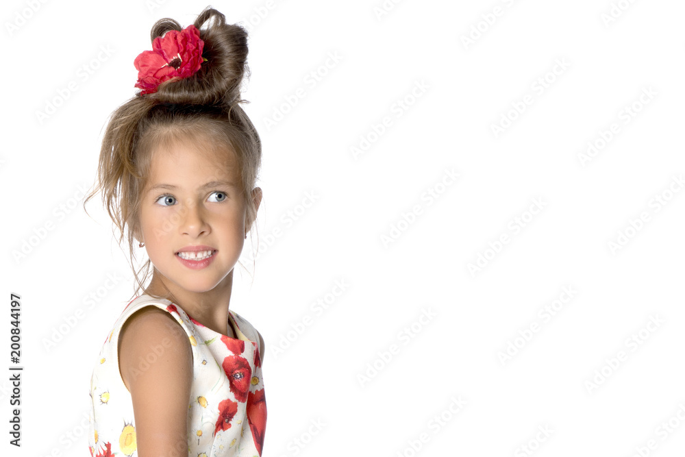 A little girl is looking from behind an empty banner. A little girl is looking from behind an empty banner.
