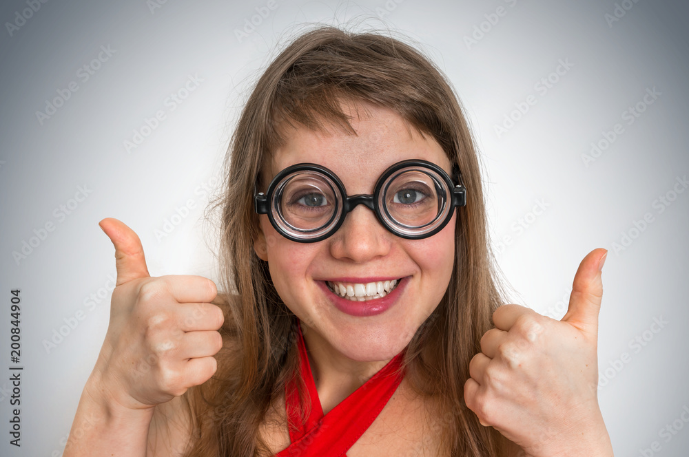 Funny geek or nerd woman isolated on gray background