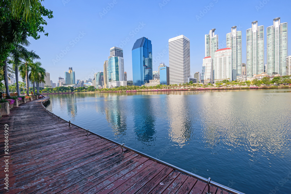 Lake view with reflections of the city / high building in the city lake view