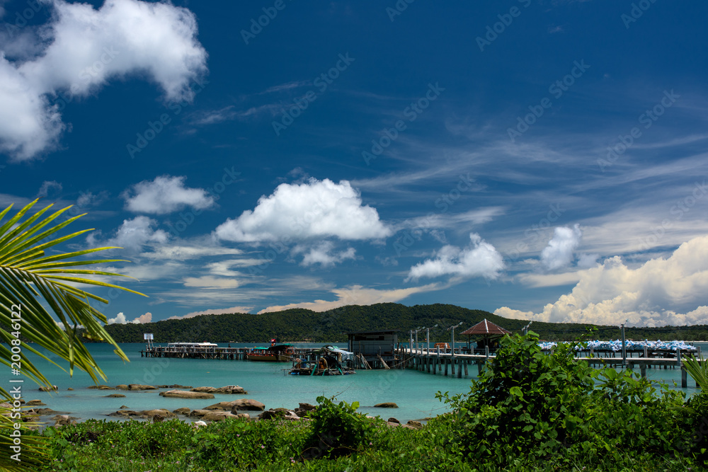 Tropical landscape of Koh Rong Samloem island with turquoise water and pier in the distance. Cambodia, asia.