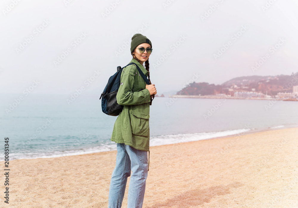 summer spring vacation, holidays, travel, road trip and people concept - happy smiling teenage girl or young woman at ocean background,Italy. tourist look on blue sun ocean, lifestyle concept summer spring vacation, holidays, travel, road trip and people concept - happy smiling teenage girl or young woman at ocean background,Italy. tourist look on blue sun ocean, lifestyle concept