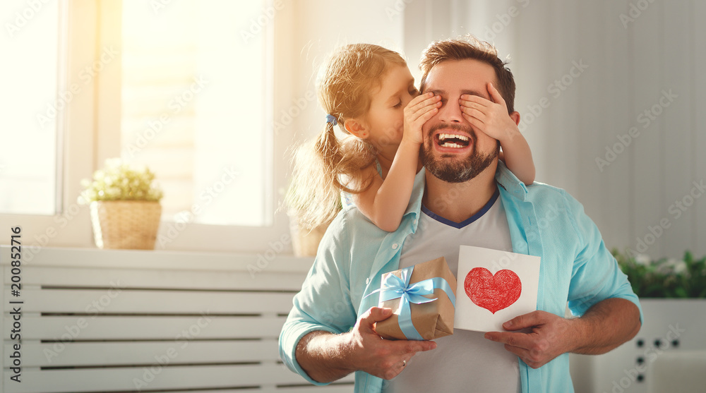 Father's day. Happy family daughter hugging dad and laughs - obrazy, fototapety, plakaty 