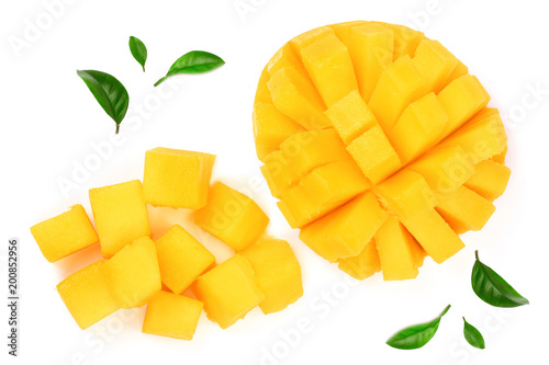 half of Mango fruit decorated with leaves isolated on white background close-up. Top view. Flat lay