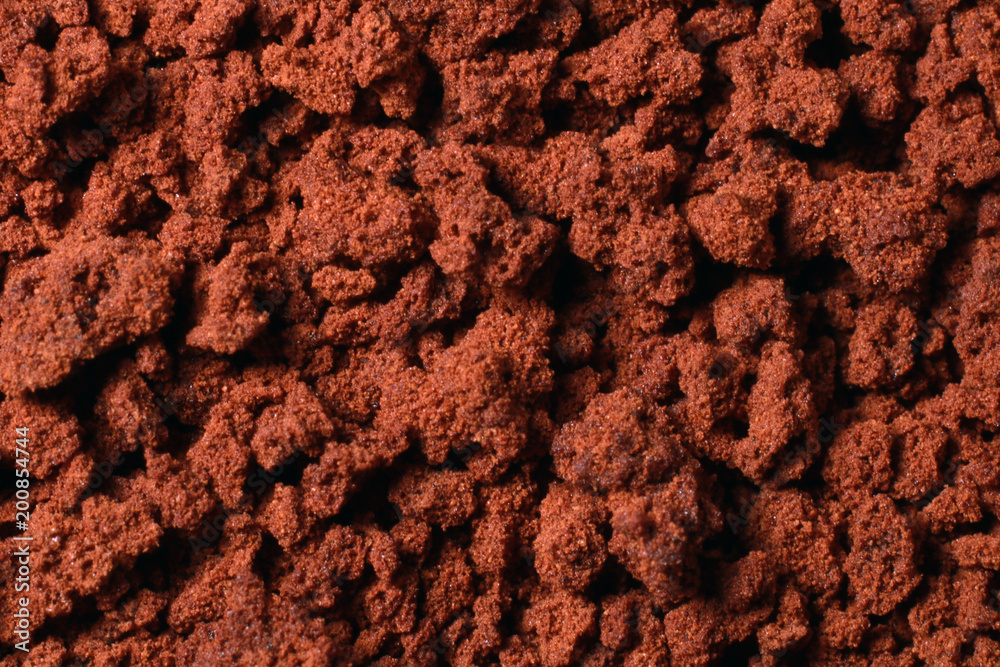 Instant coffee in granules. Instant coffee background macro.