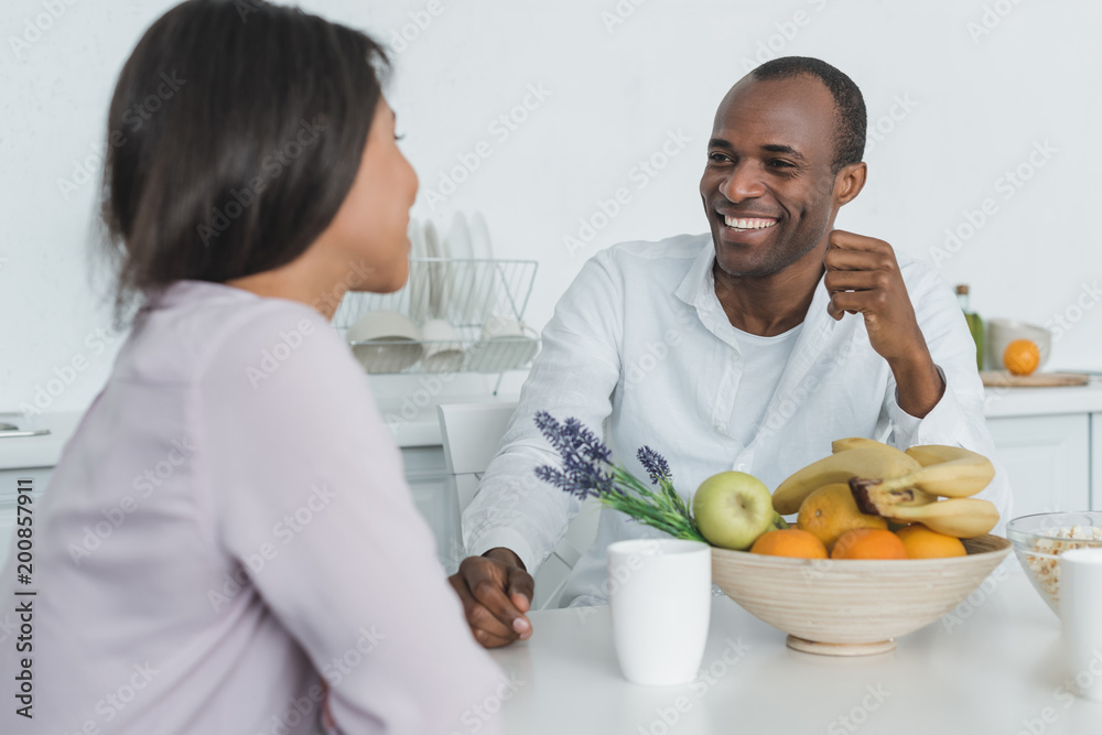 african american girlfriend and boyfriend sitting at table during breakfast african american girlfriend and boyfriend sitting at table during breakfast