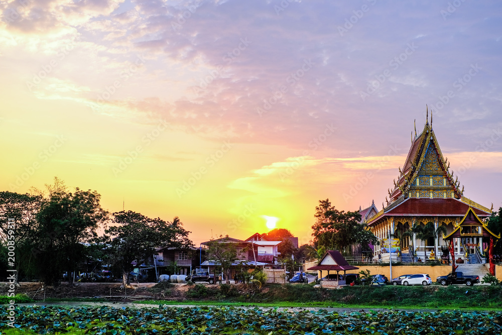 Sunset at Buddhist temple in rural Thailand.
