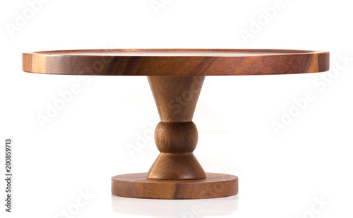 Empty wooden stand for cake on white background