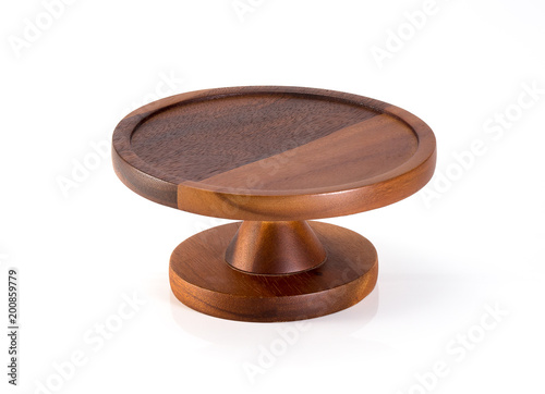 Empty wooden stand for cake on white background