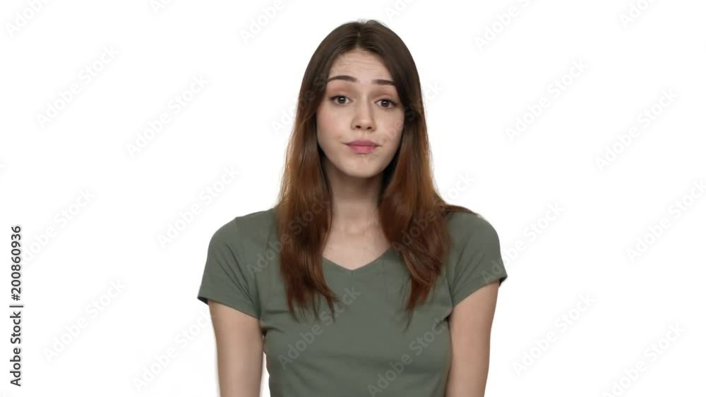 Portrait of innocent woman throwing up hands in rejection meaning do not know cannot help or have no idea, isolated over white background closeup. Concept of emotions Portrait of innocent woman throwing up hands in rejection meaning do not know cannot help or have no idea, isolated over white background closeup. Concept of emotions