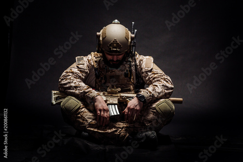 Fototapeta Naklejka Na Ścianę i Meble -  Special forces United States soldier or private military contractor. Image on a black background.