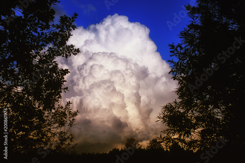 grey black cloud in a blue sky