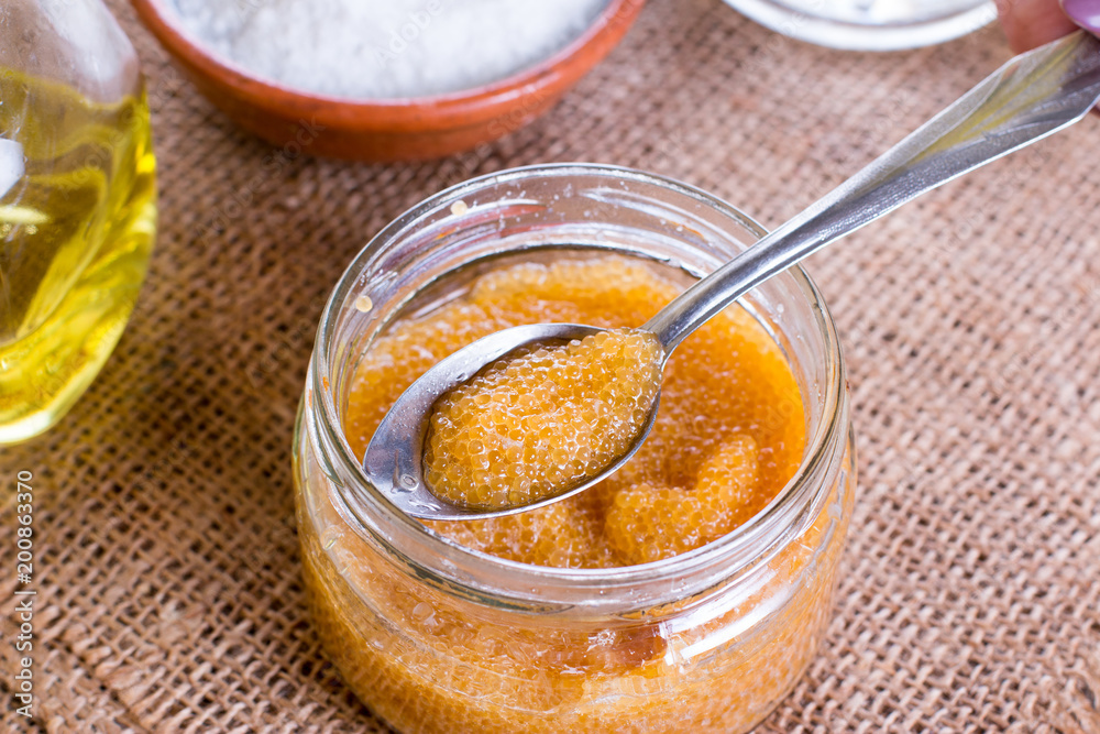 Pike caviar in a glass jar on the table Pike caviar in a glass jar on the table