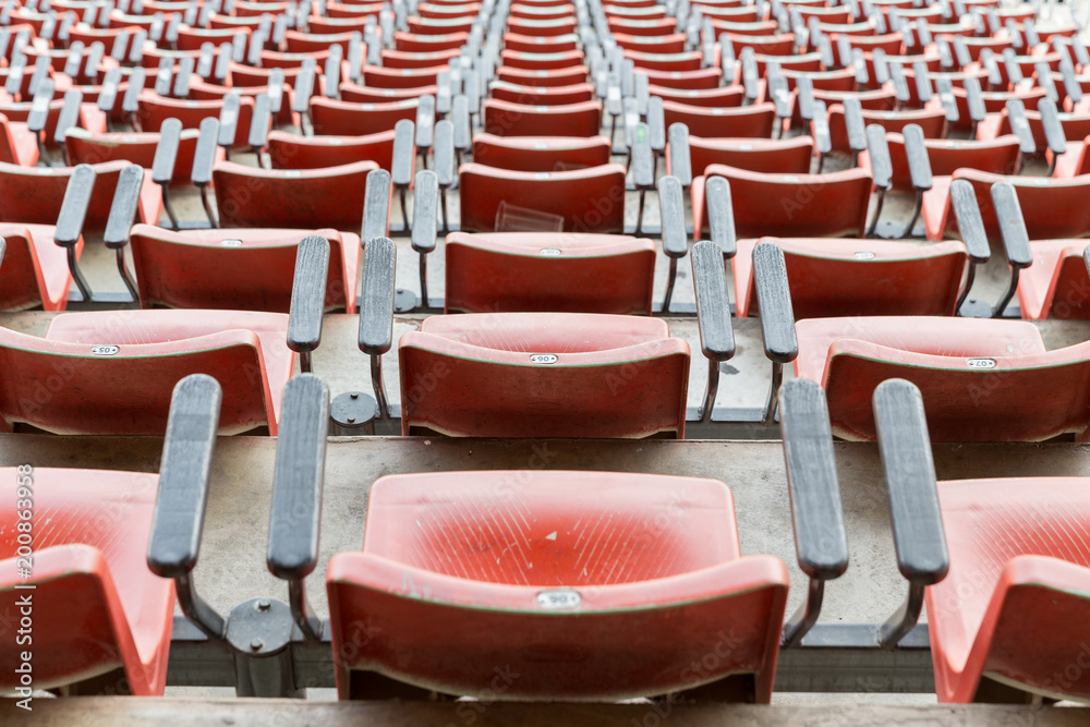 Naklejka premium Empty red seats in stadium.