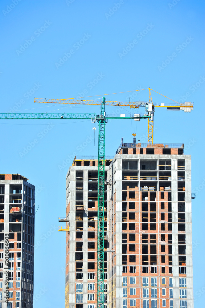 Fototapeta premium Crane and highrise construction site