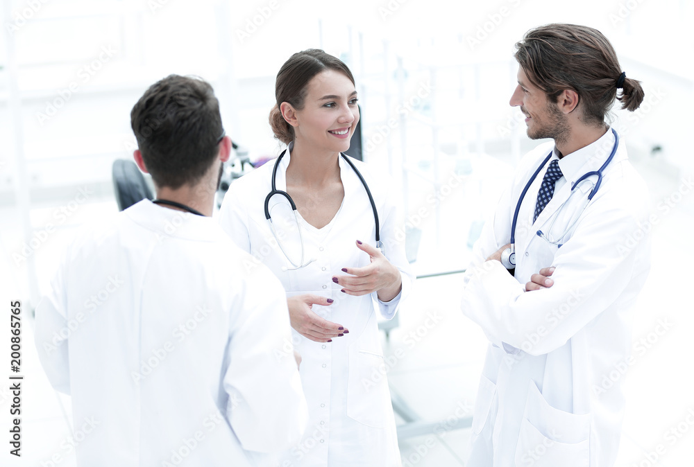 Team of different doctors having conversation Team of different doctors having conversation
