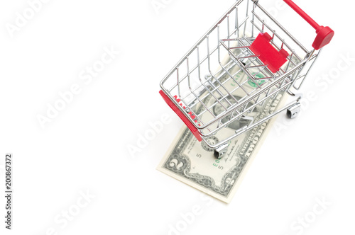 Dollar and shopping cart on white background : economy concept