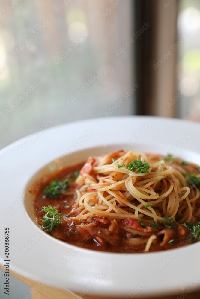 spaghetti Bolognese with minced beef and tomato sauce garnished with parmesan cheese and basil , Italian food spaghetti Bolognese with minced beef and tomato sauce garnished with parmesan cheese and basil , Italian food