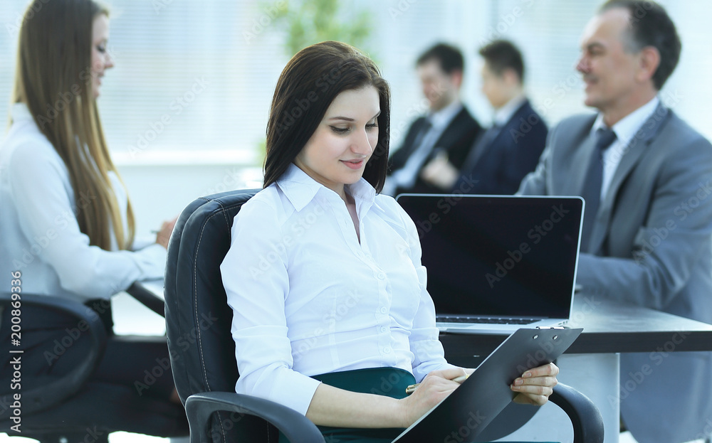 young business business woman reading document, sitting in the office young business business woman reading document, sitting in the office