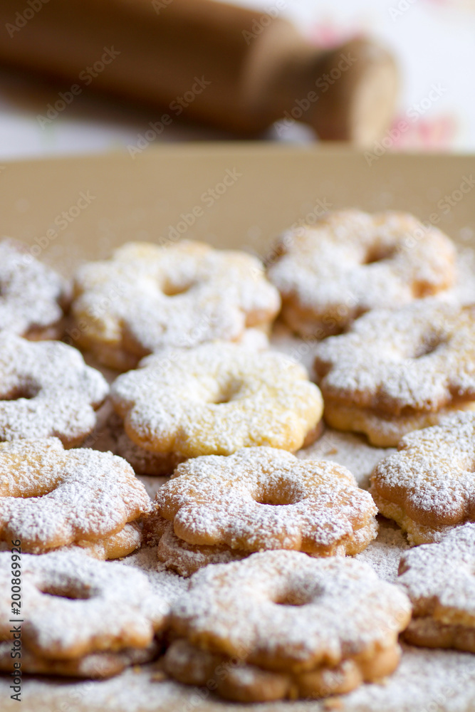 group of canestrelli biscuits covered of icing sugar on a plate group of canestrelli biscuits covered of icing sugar on a plate