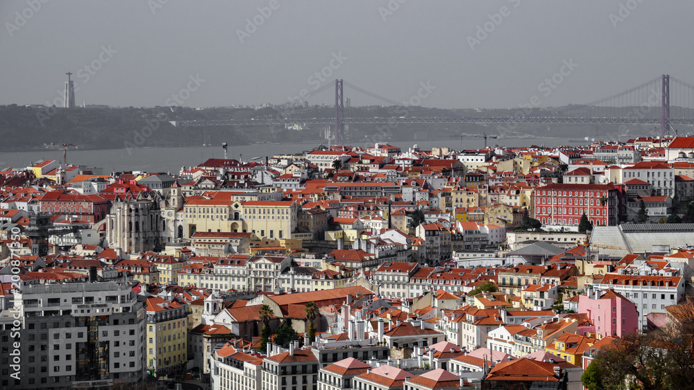Rooftops with the bridge creating a line on the horizon of Lisbon