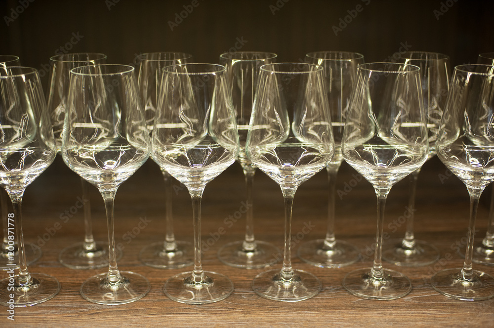 Glasses for wine on a wooden table. Glasses for wine on a wooden table.