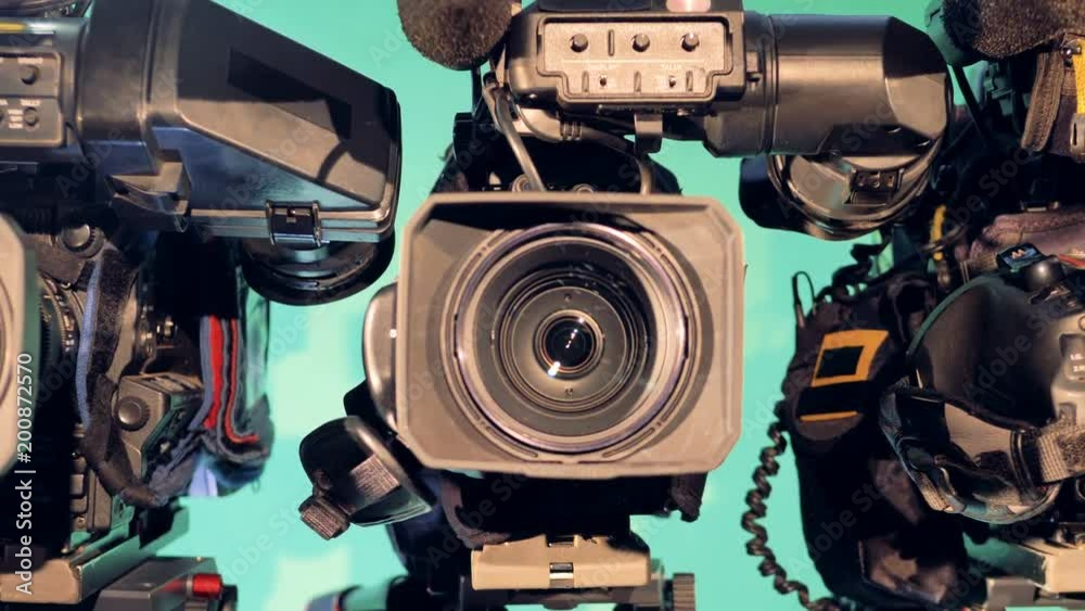 Zoomed-in footage of one video camera with its lens