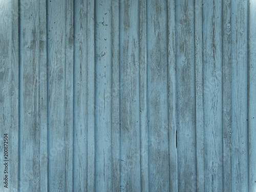 Barn wood wall with distressed  peeling blue paint