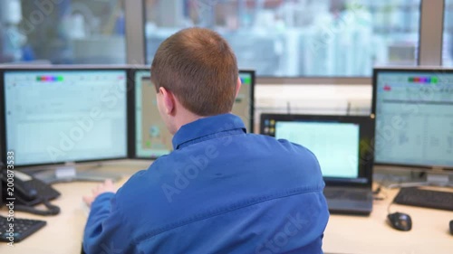 plant, paint factory, dispatching, technical process, the operator sits in front of the computer