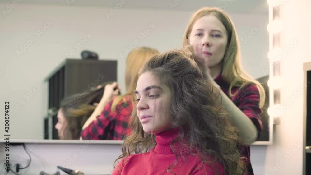 Young attractive woman getting her hairdressing in the hair salon Young attractive woman getting her hairdressing in the hair salon