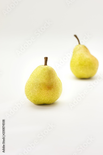 Yellow ripe pears isolated on white background