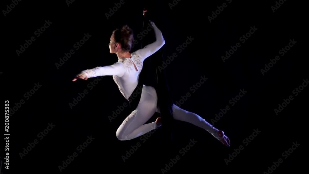 Girl dancer on aerial silk. Slow Motion. Aerial gymnastic. Acrobatic show. Girl dancer on aerial silk. Slow Motion. Aerial gymnastic. Acrobatic show.