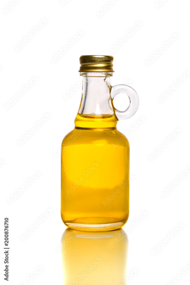 Small bottle with olive or sunflower oil isolated on the white background. Small bottle with olive or sunflower oil isolated on the white background.