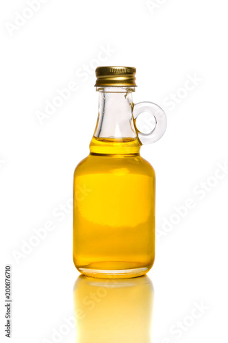 Small bottle with olive or sunflower oil isolated on the white background.