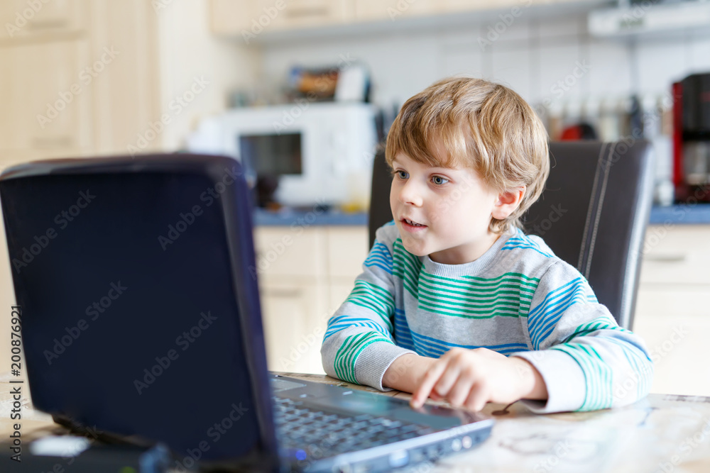 kid boy surfing internet and playing on computer kid boy surfing internet and playing on computer