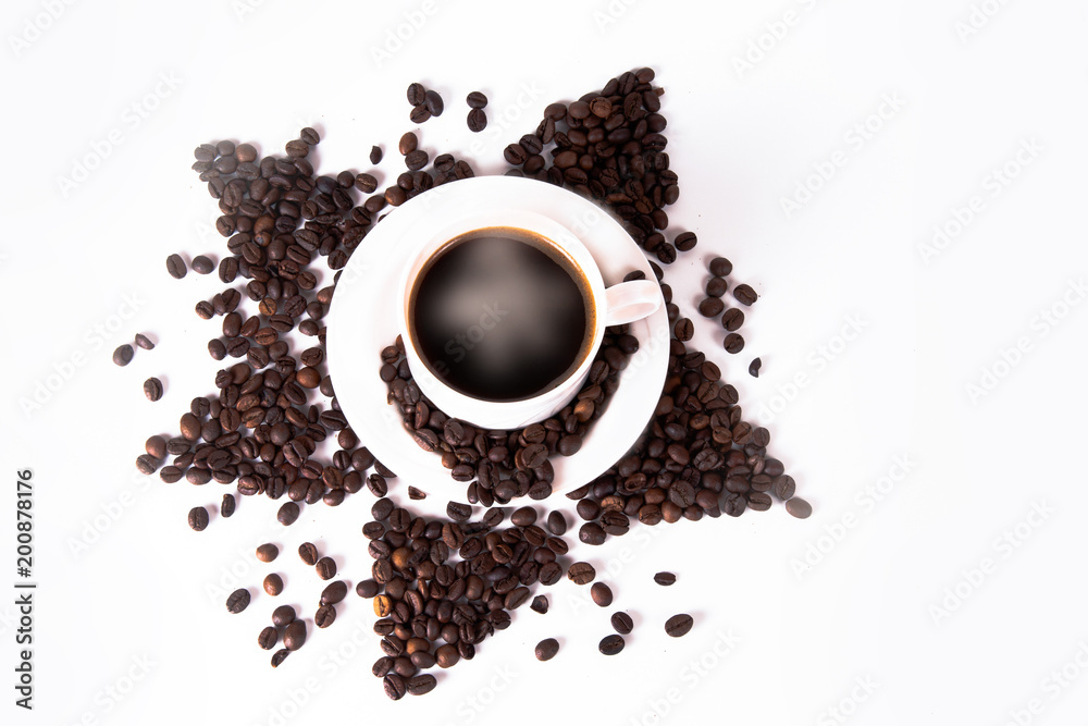Coffee cup and beans on old kitchen table. Top view with copyspa