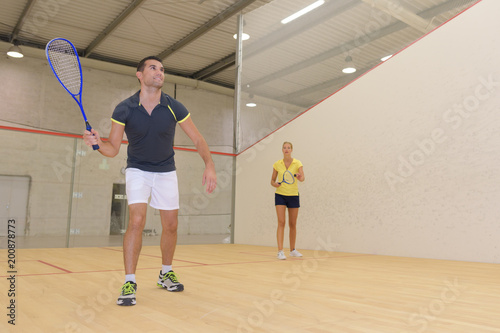 man playing squash