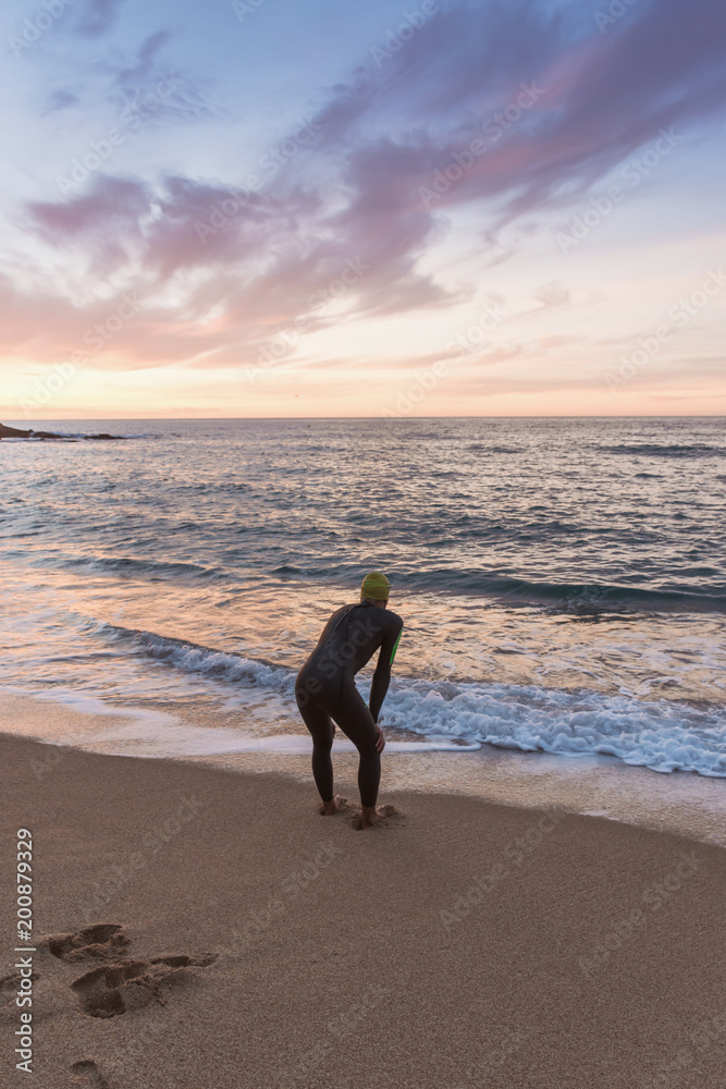 Triathlete training for the ironman at sea. Triathlete training for the ironman at sea.