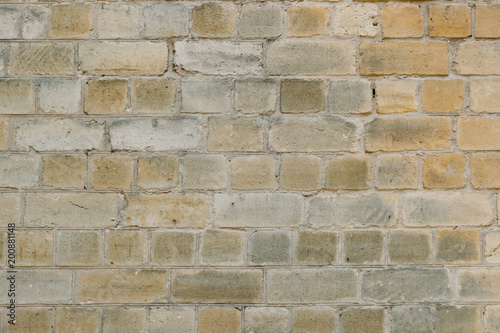 Old yellow brick wall for texture or background