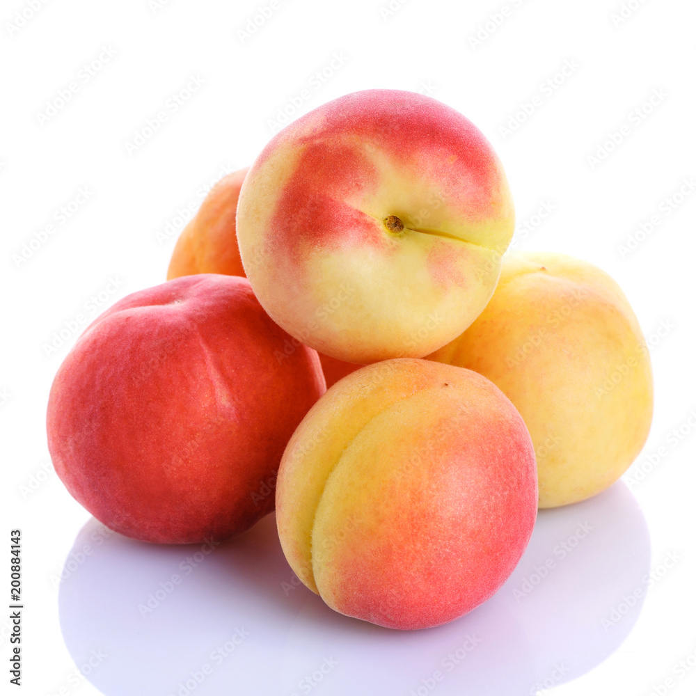 Fresh organic peaches isolated on white background